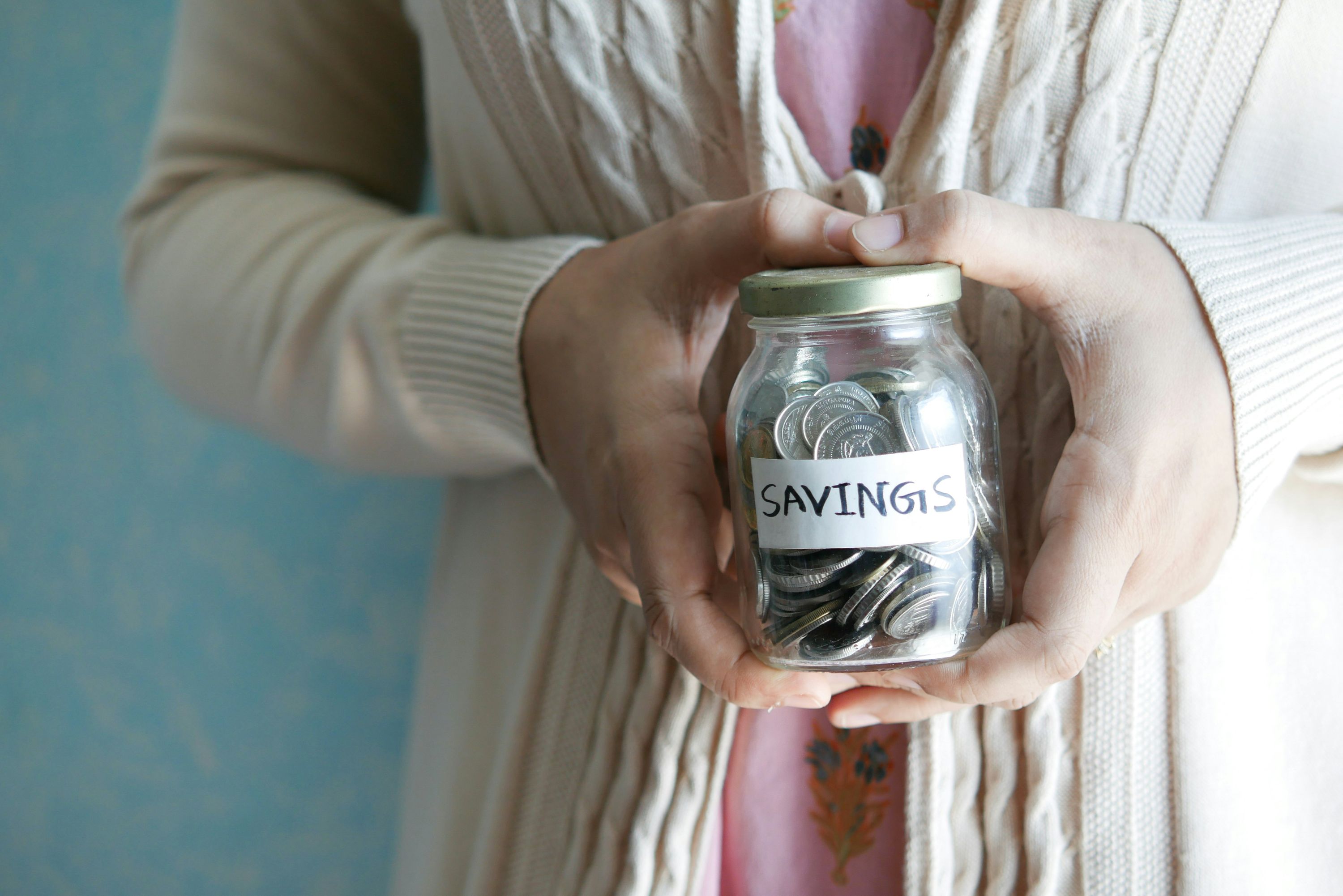 A small jar of coins. Implies one-time payment and savings.